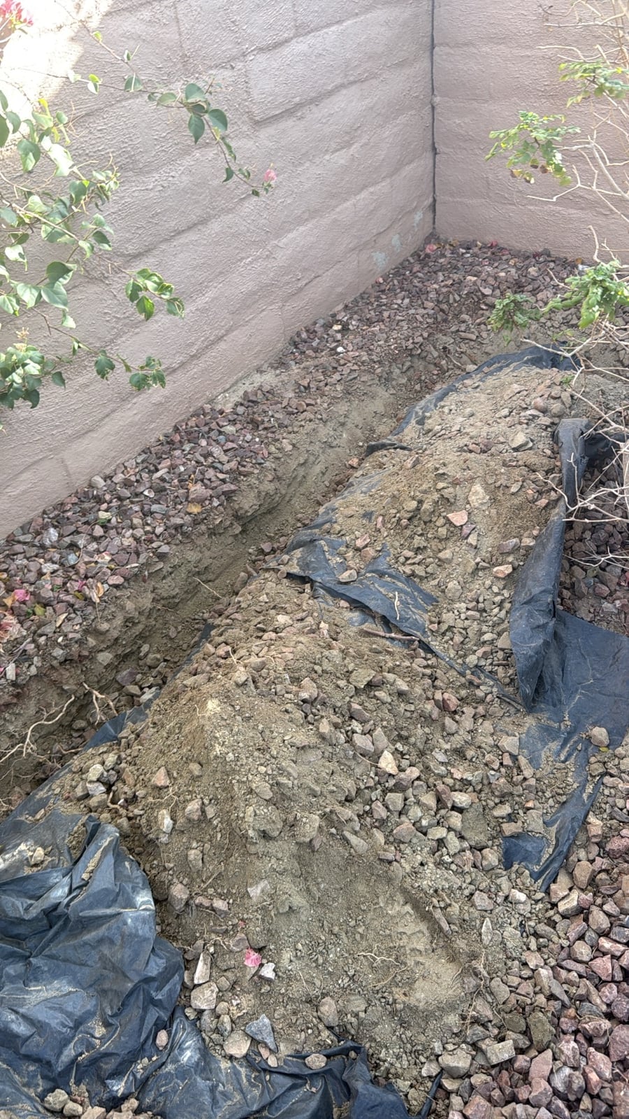 Underground pipeline trenching and clean tarping on residential estate